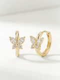 Leia Butterfly CZ Huggie Earrings gold tone stainless steel, butterfly motif with CZ stones, product flatlay