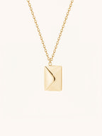 Love Letter Pendant Necklace in gold tone titanium, envelope locket closed front view