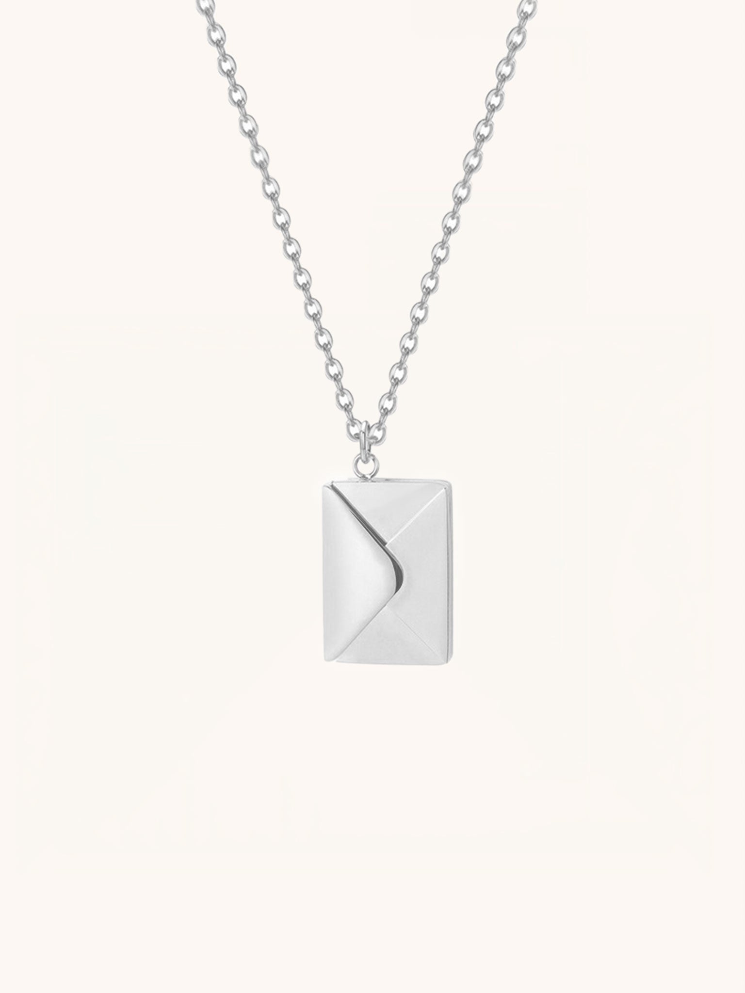 Love Letter Pendant Necklace in silver tone titanium, envelope locket closed front view