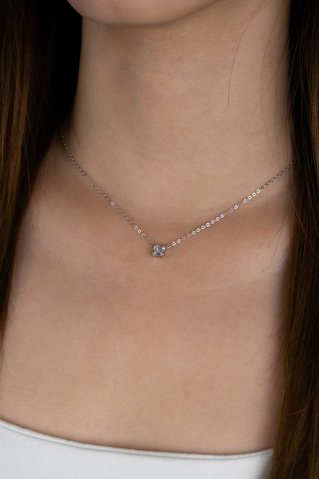 Model wearing LUCA Square Diamond Necklace at the collarbone