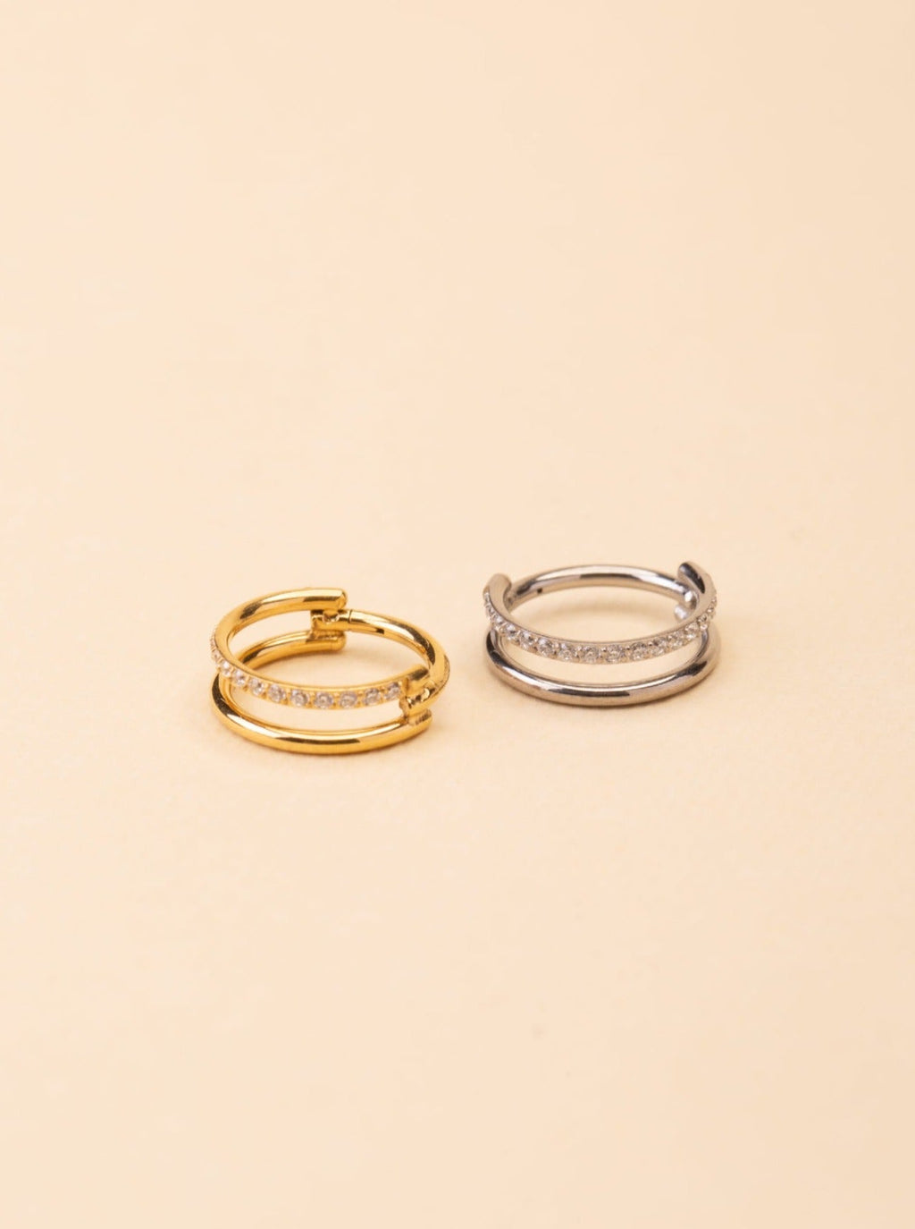 Lumi Diamonds Nose Ring gold and silver tone titanium, double-band pavé CZ nose ring, product flatlay