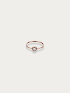 Lune Band Ring rose gold tone titanium, slim band with single bezel-set CZ stone, product flatlay
