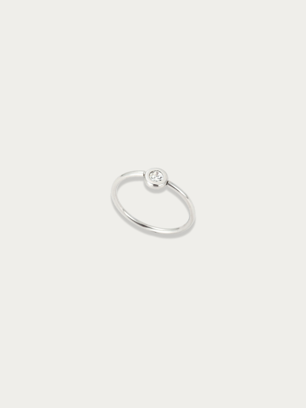 Lune Band Ring silver tone titanium, slim band with single bezel-set CZ stone, product flatlay