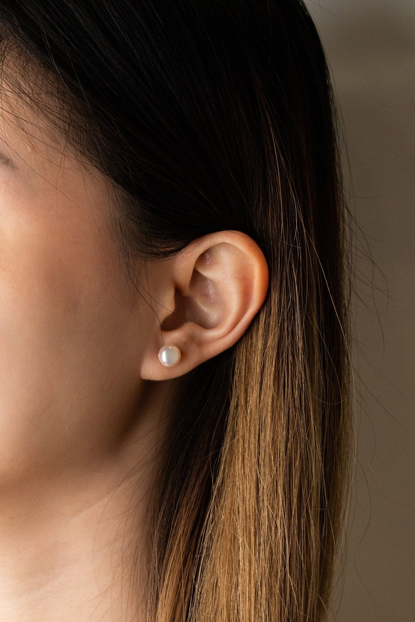 Close-up of single MACY Freshwater Pearl stud earring