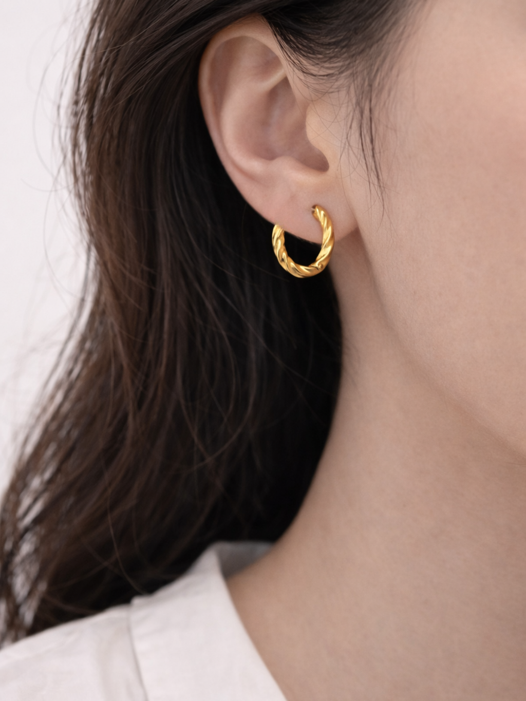 Model wearing Mardea Minimalist Twist Hoop Earrings