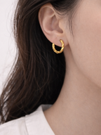 Model wearing Mardea Minimalist Twist Hoop Earrings