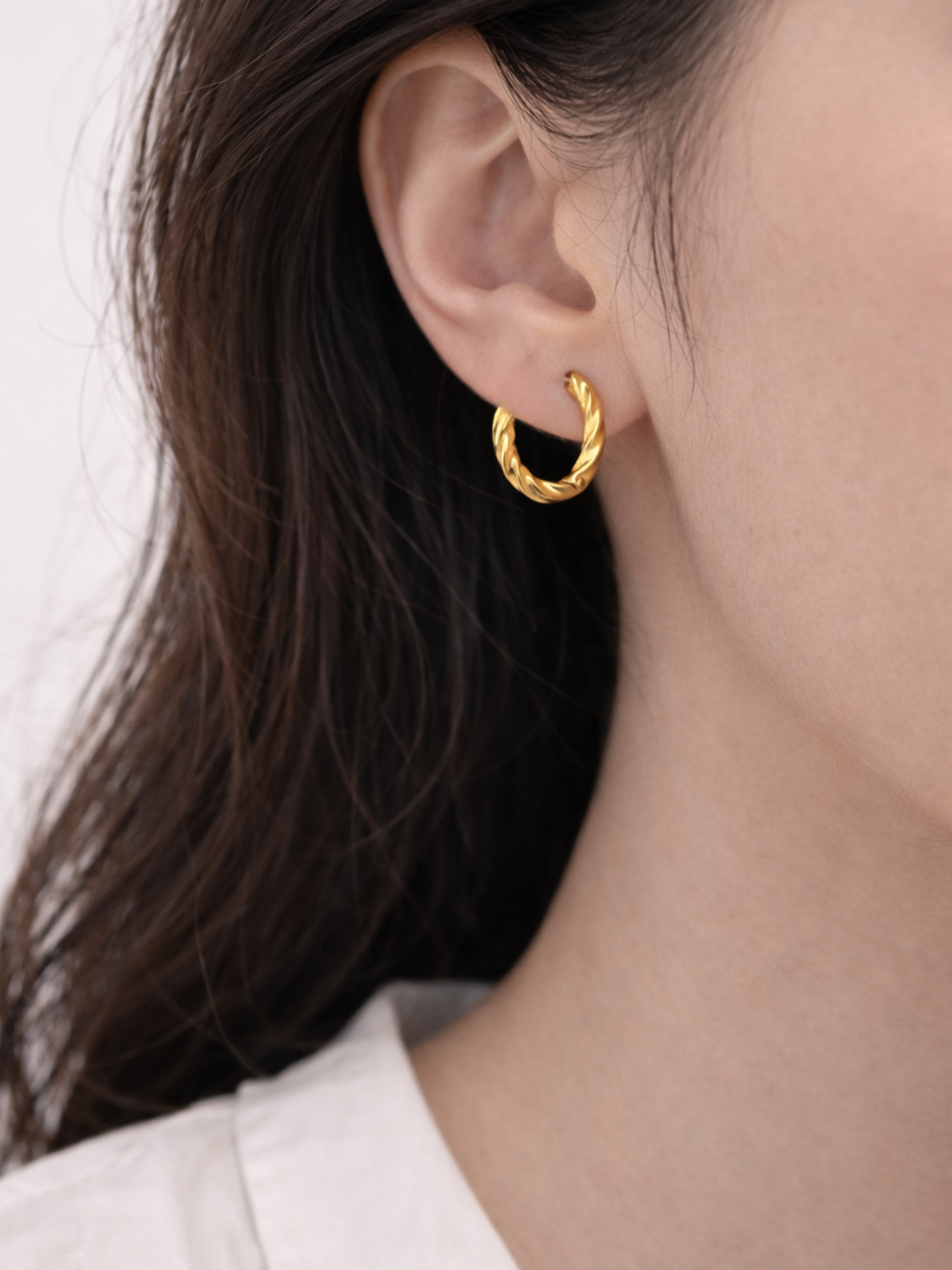 Model wearing Mardea Minimalist Twist Hoop Earrings