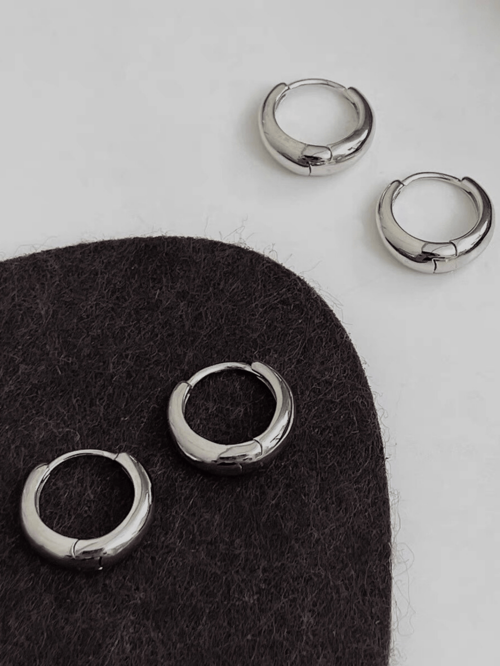 Mason Mini Arc Hoops flatlay in gold and silver colourways