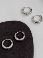 Mason Mini Arc Hoops flatlay in gold and silver colourways