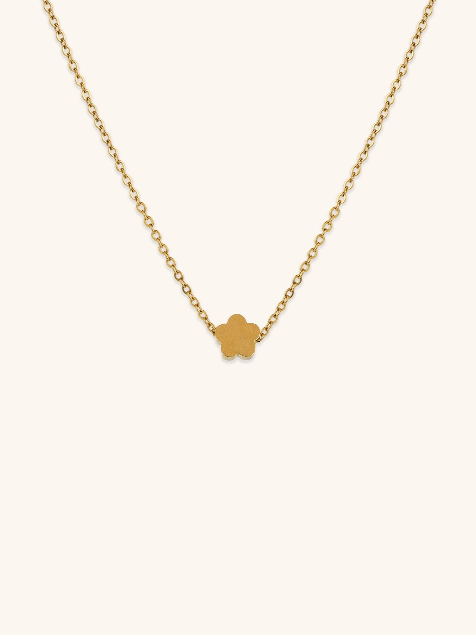 Mini Flower Engravable Necklace gold tone titanium, flat five-petal flower pendant on fine cable chain, product flatlay