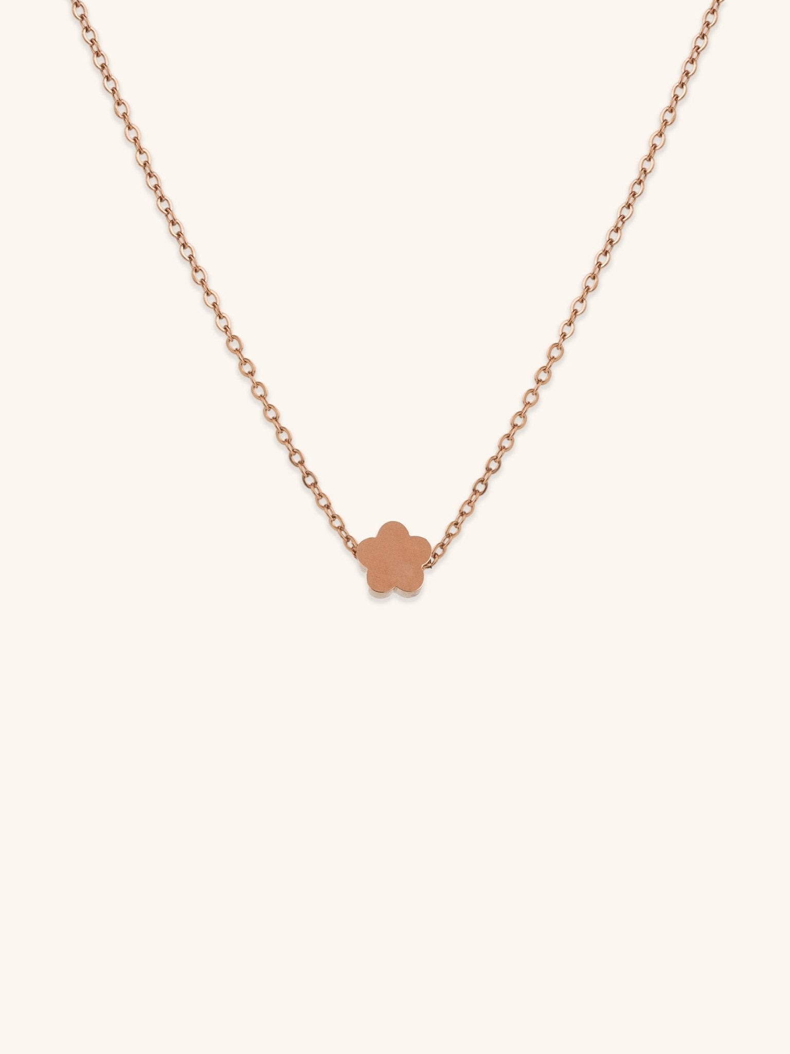 Mini Flower Engravable Necklace rose gold tone titanium, flat five-petal flower pendant on fine cable chain, product flatlay