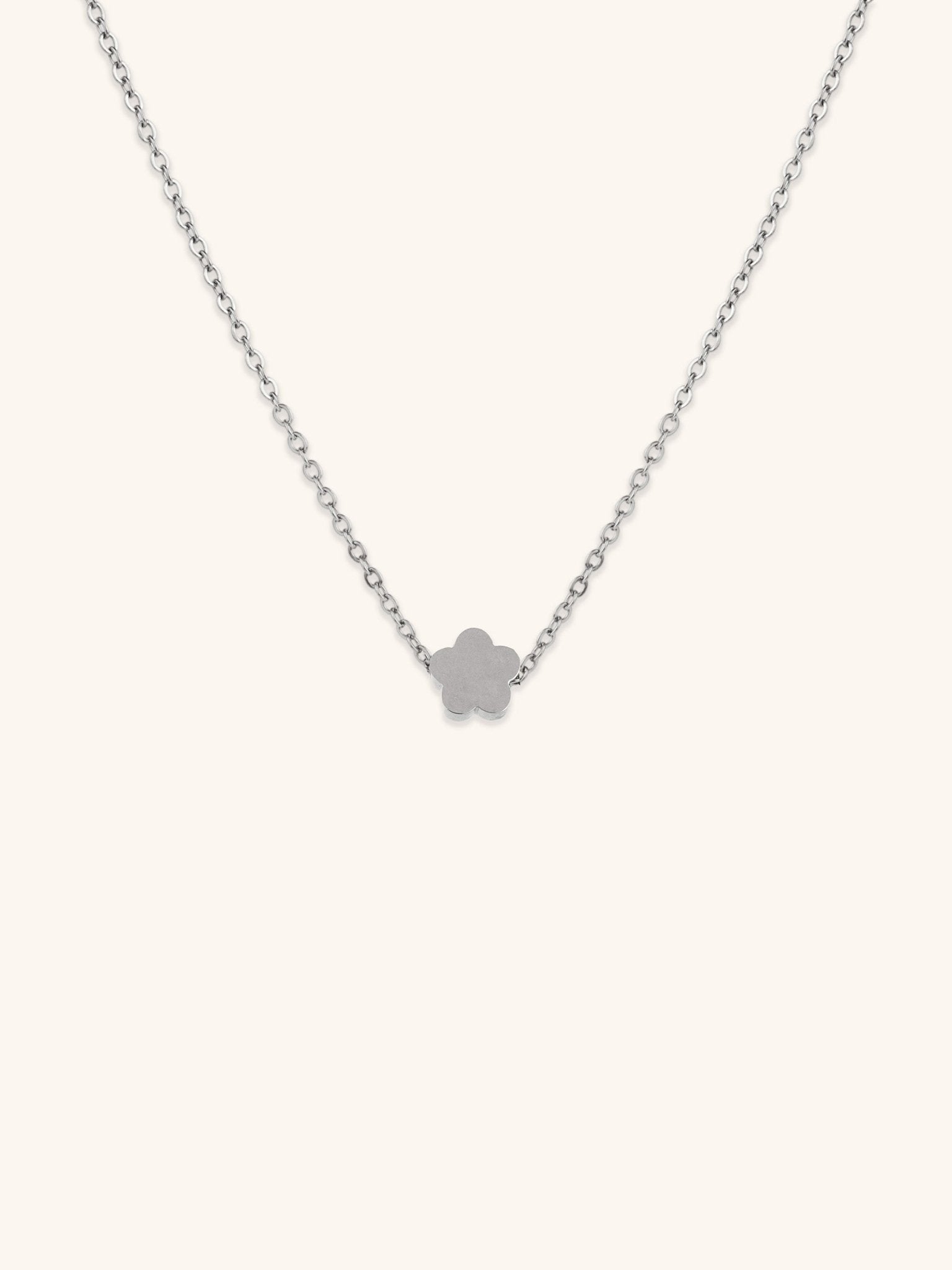 Mini Flower Engravable Necklace silver tone titanium, flat five-petal flower pendant on fine cable chain, product flatlay