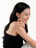 Mini Nova Curve Earrings worn on model's ear