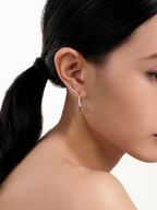 Close-up of fluid open curve on Mini Nova Curve Earring