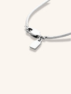 Close-up of smooth round snake chain links on Minimalist Snake Chain Necklace, silver tone titanium