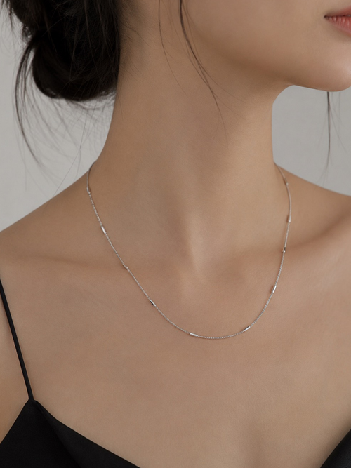 Close-up of tube link detailing on Minimalist Tube Link Necklace