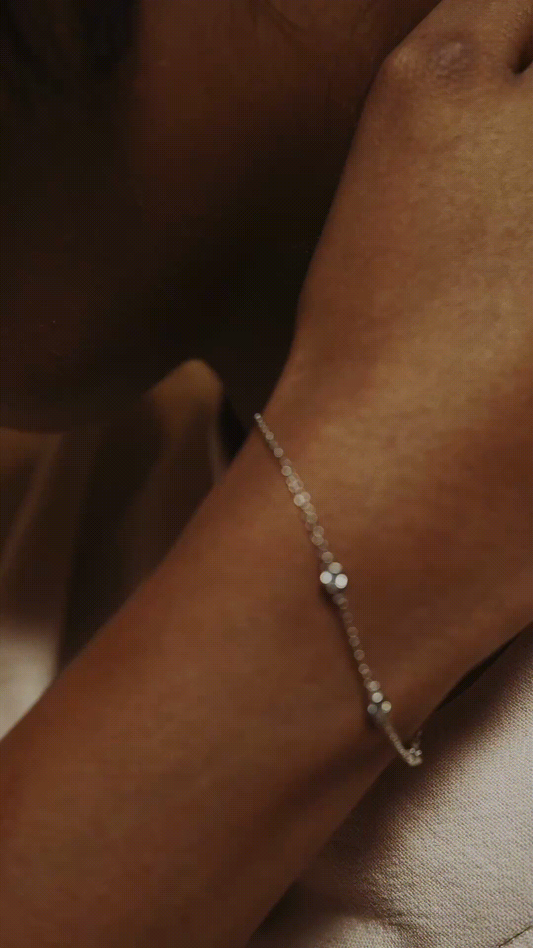 Close-up of bezel-set cubic zirconia station on ALEXIS bracelet