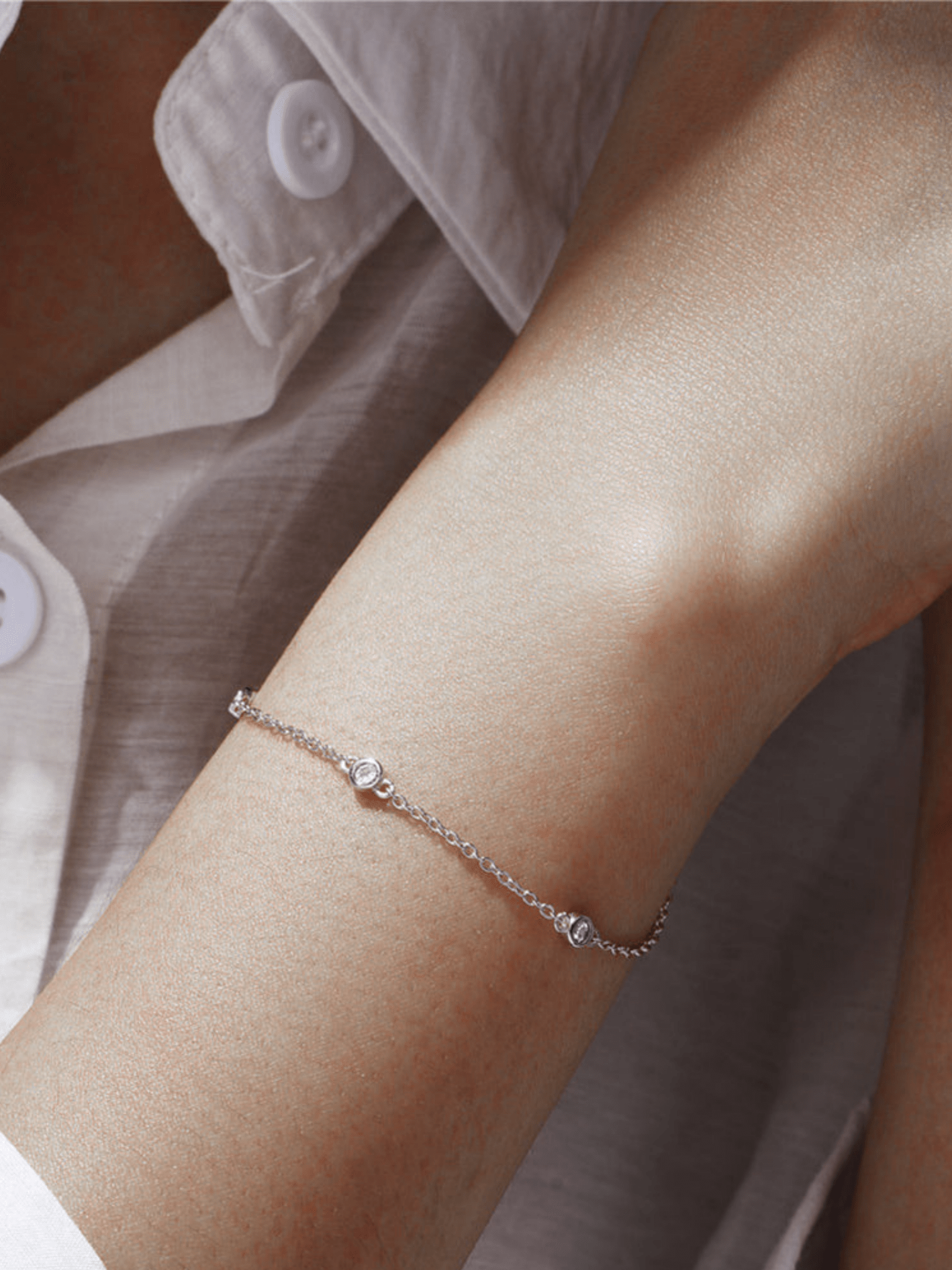 ALEXIS bracelet stacked with other minimalist bracelets