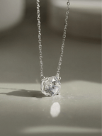 Close-up of 1ct round brilliant moissanite on MNML Amélie Necklace — fire and brilliance detail