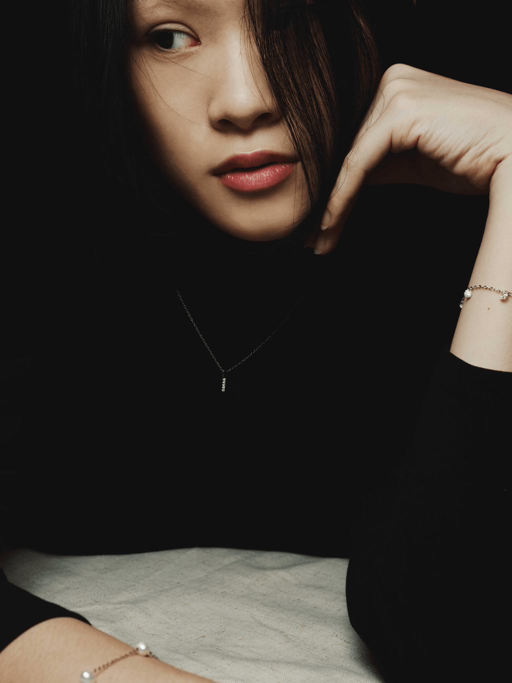 ARDEN necklace layered with other minimalist chains