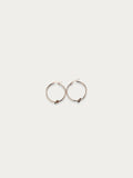 Aria Knot Hoop Earrings in rose gold titanium on a white background.