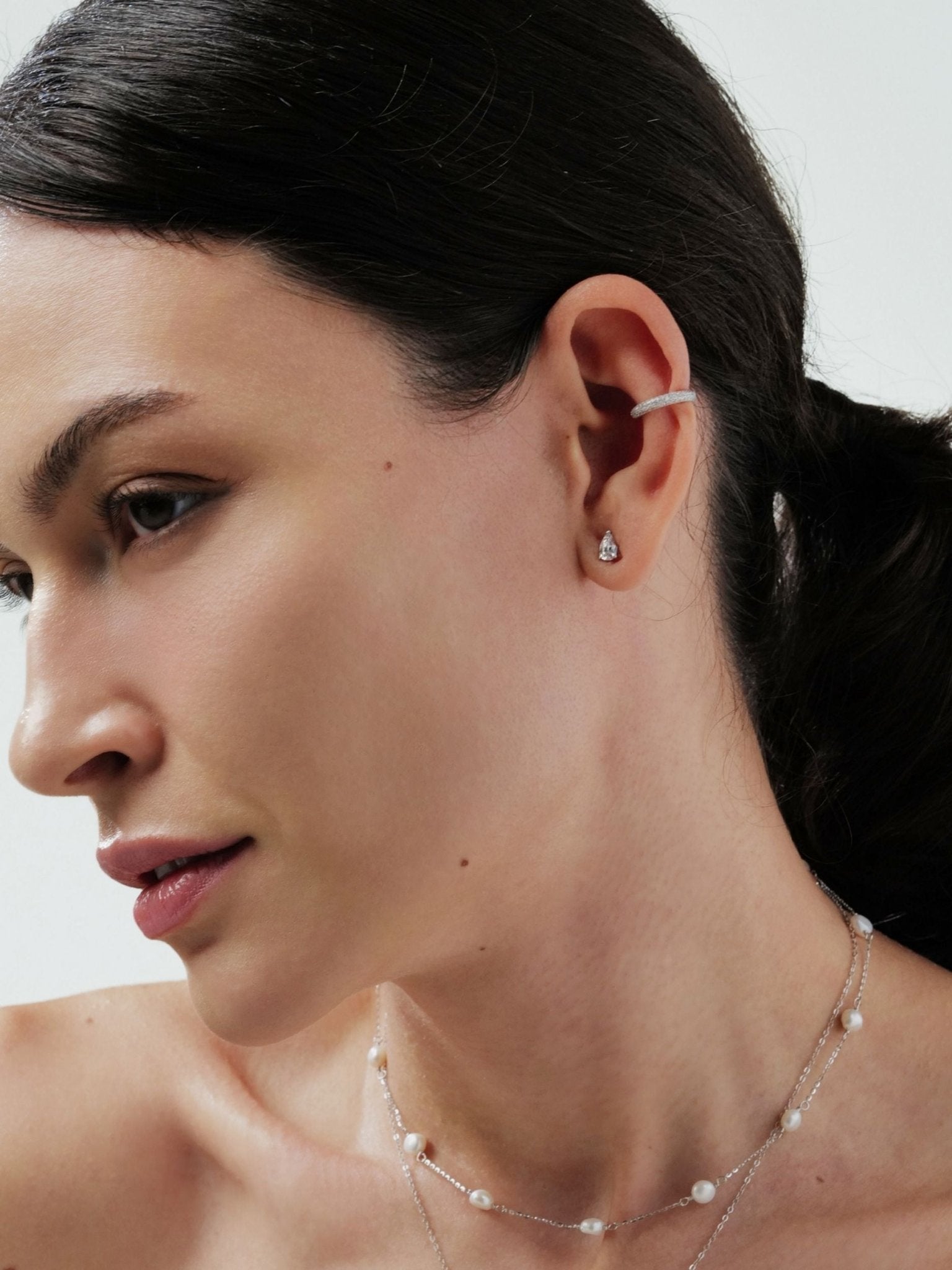 Aurélie teardrop stud earring worn on the ear
