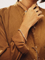 Female model wearing MNML Bold Curb Chain Engravable Bracelet — everyday chain bracelet Malaysia