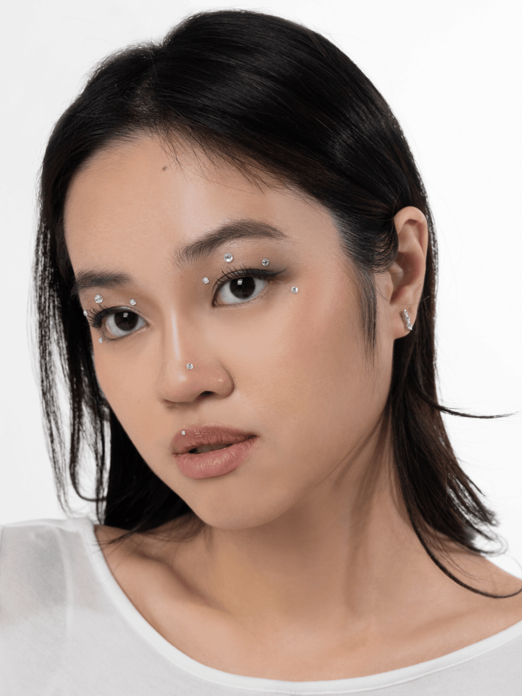 Camey Lush Trio earring worn on the ear lobe