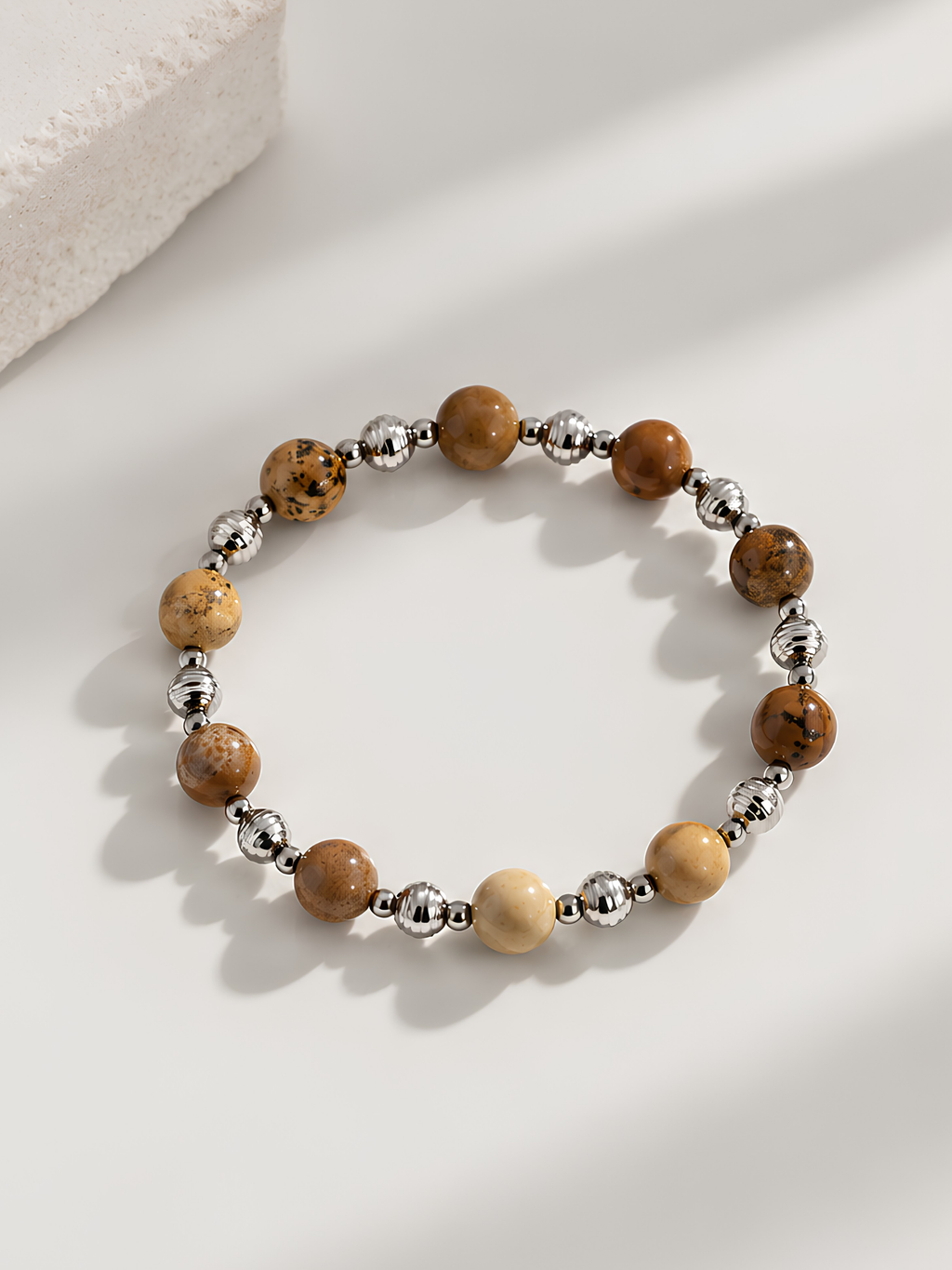 Close-up of the speckled, earth-toned beads on the Canyon bracelet