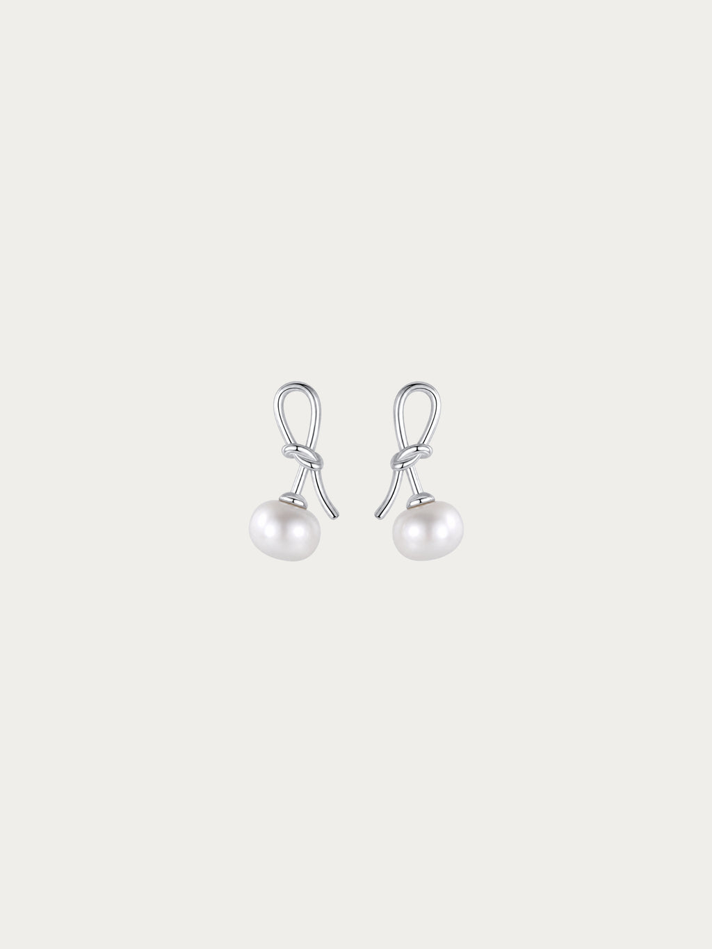 Cherry Bloom earrings with a genuine freshwater pearl hanging from a knotted 925 sterling silver stem, front view