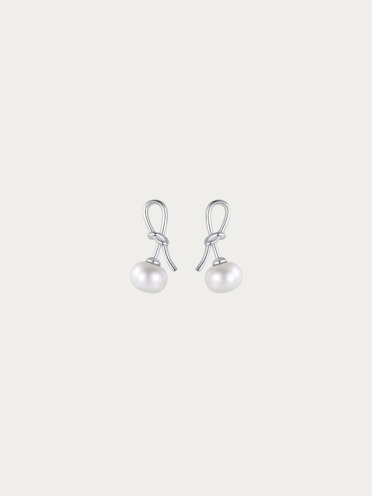 Cherry Bloom earrings with a genuine freshwater pearl hanging from a knotted 925 sterling silver stem, front view