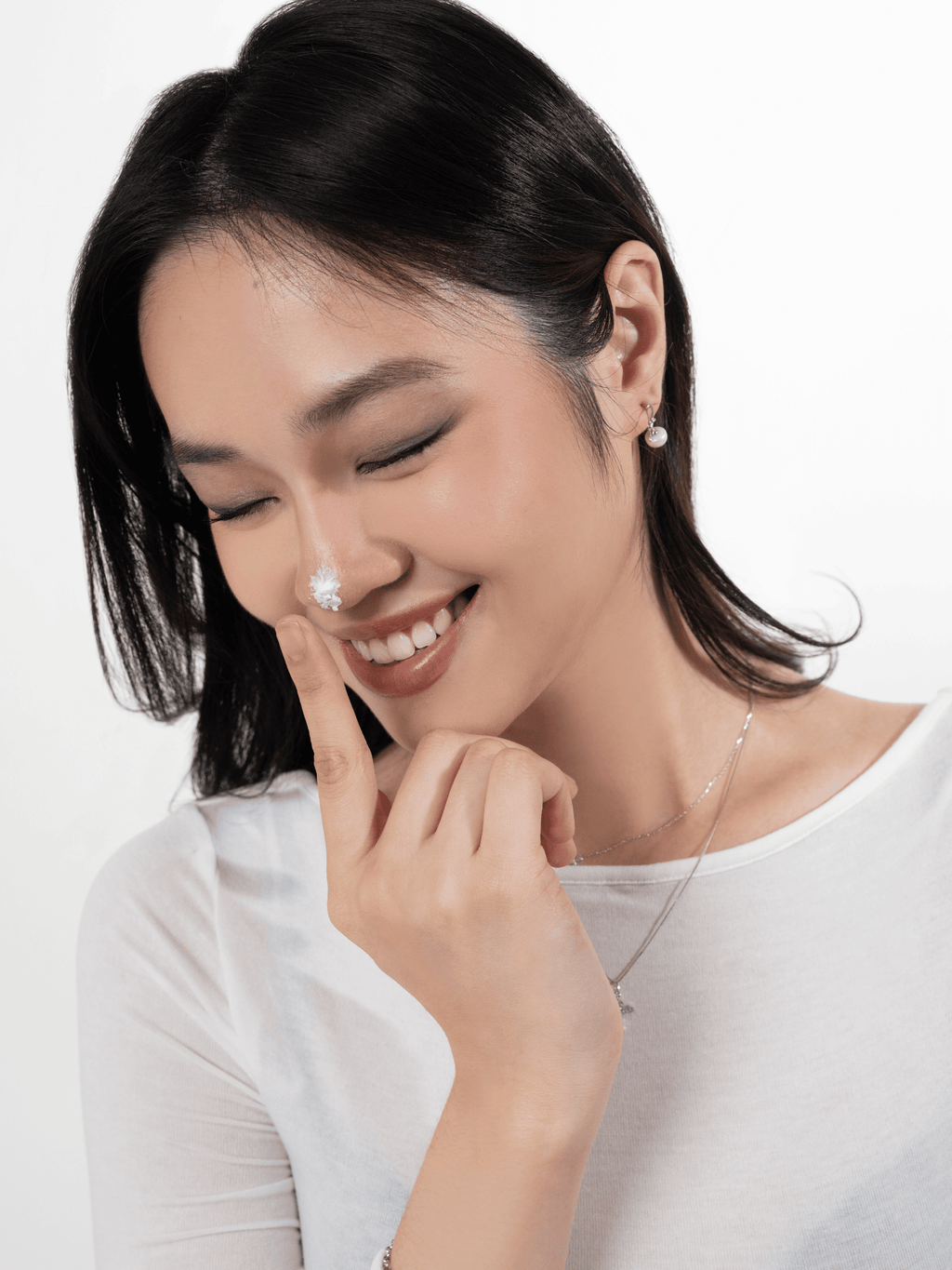 Cherry Bloom freshwater pearl earring worn on the ear lobe