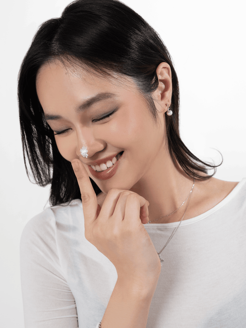 Cherry Bloom freshwater pearl earring worn on the ear lobe