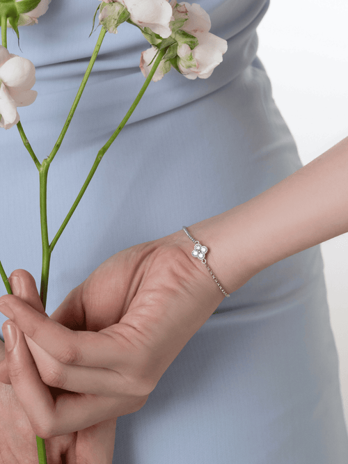 Clara Fortune moissanite clover bracelet worn on the wrist
