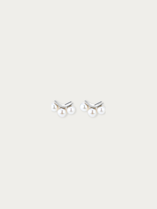 Close-up of three freshwater pearls on Clara earring