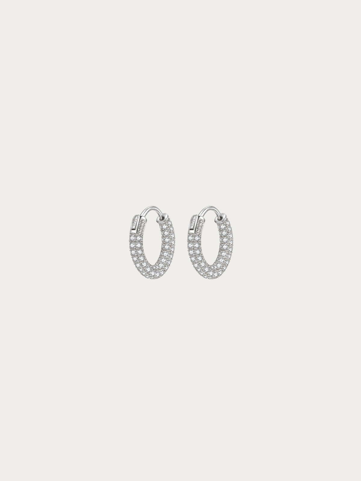 Classic Lush Pavé Huggie Hoop Earrings with a three-row pavé CZ band in rhodium-plated 925 sterling silver, front view