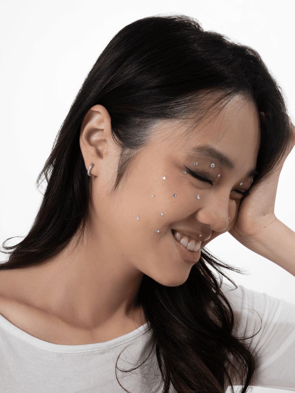 Classic Lush pavé huggie worn snug at the ear lobe
