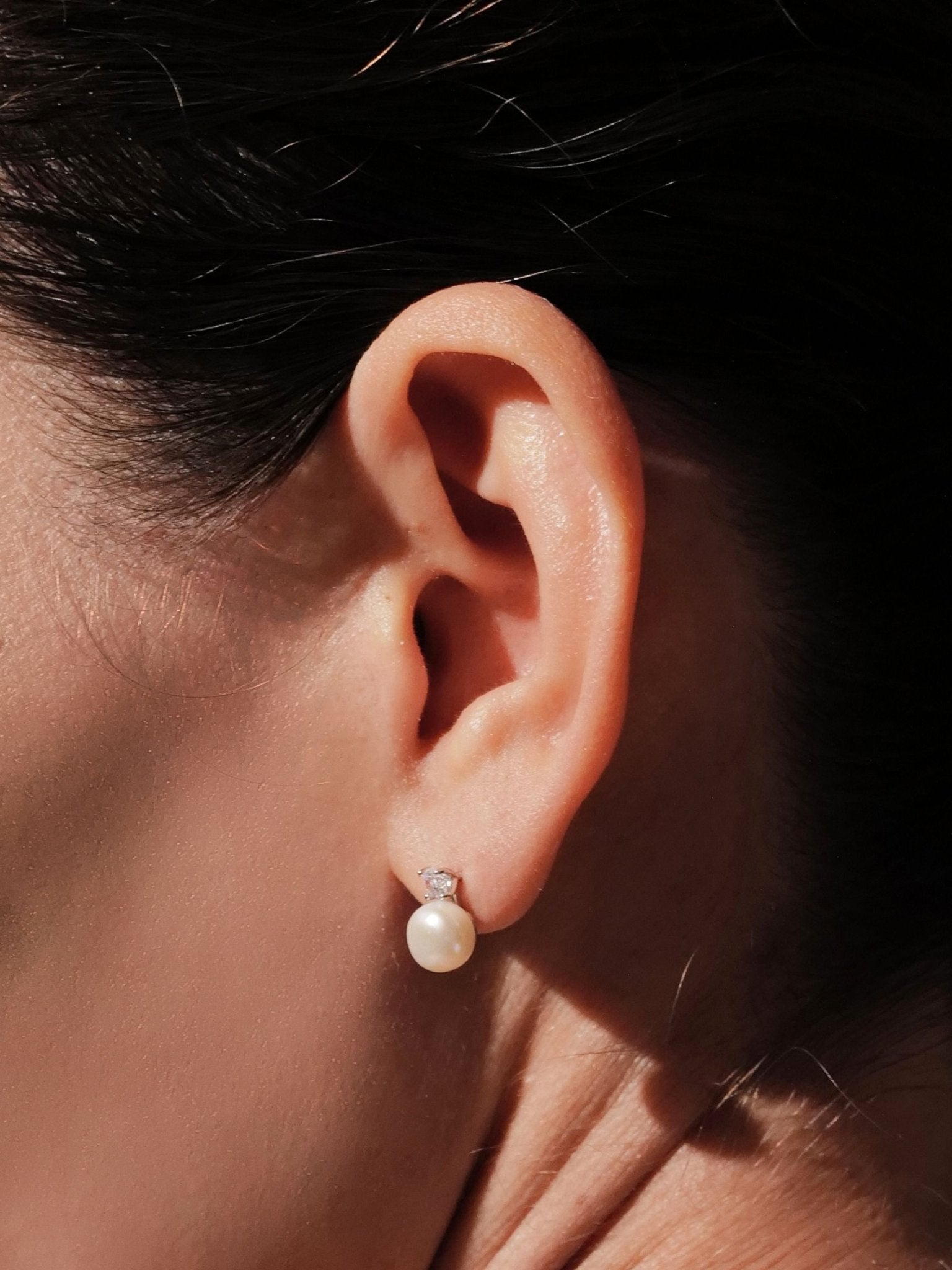 Side view of Colette pearl stud earring showing CZ and pearl placement