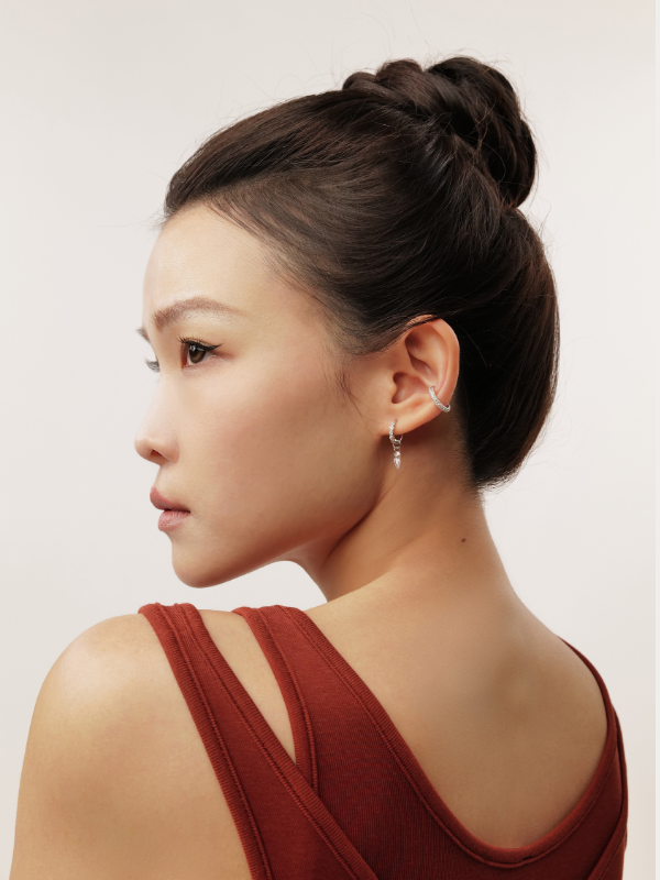 Ear curation styling with MNML Cora Prism Stone Hoop layered with flatback studs and huggies