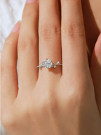 Six-prong setting close-up on MNML Elijah Moissanite Bloom Ring — elevated solitaire 925 silver