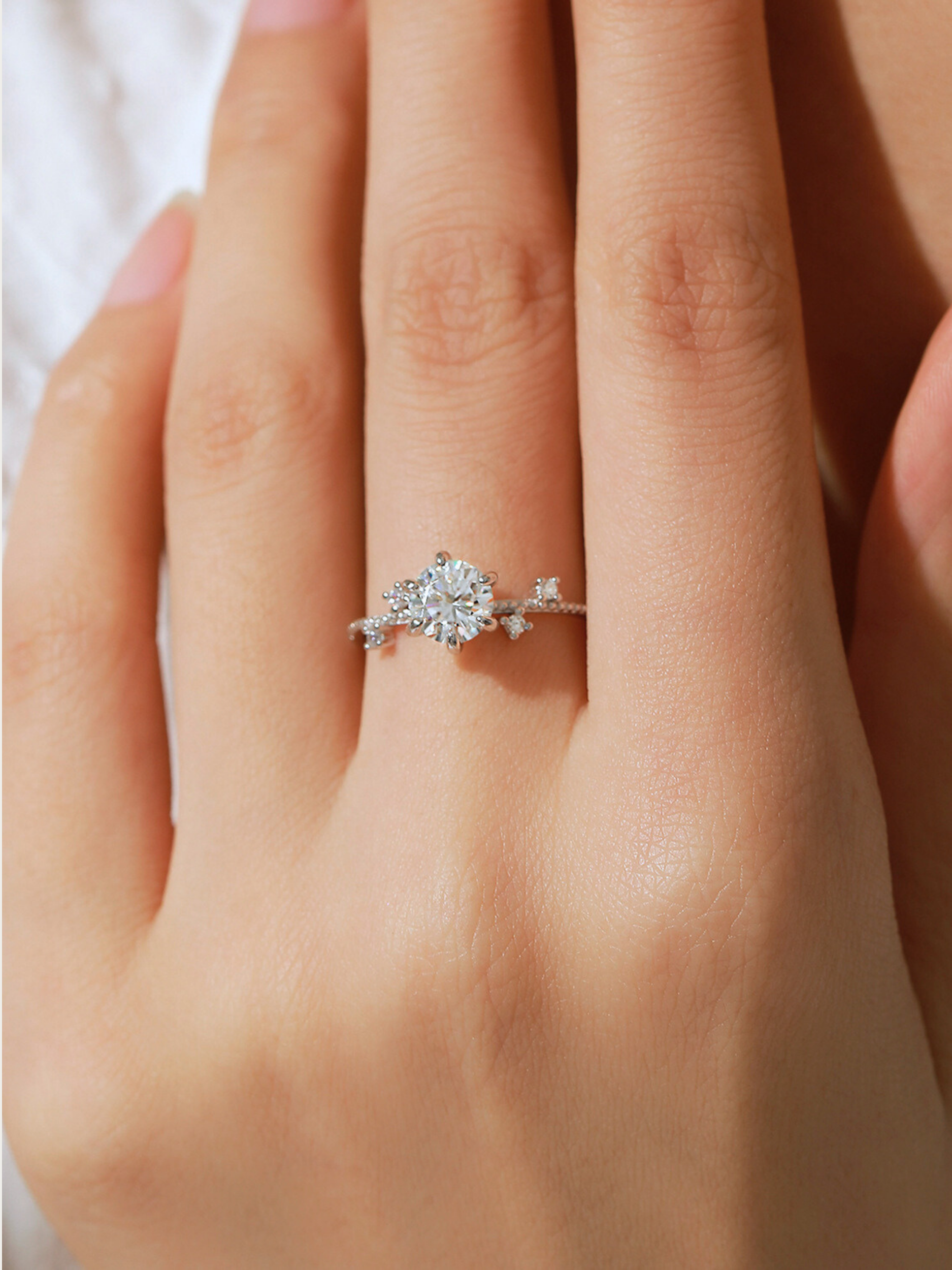 Six-prong setting close-up on MNML Elijah Moissanite Bloom Ring — elevated solitaire 925 silver