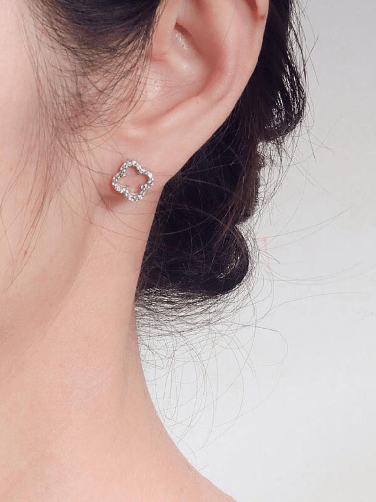 Model wearing MNML Élise Hollow Clover Stud Earrings at lobe — symbolic clover earrings Malaysia