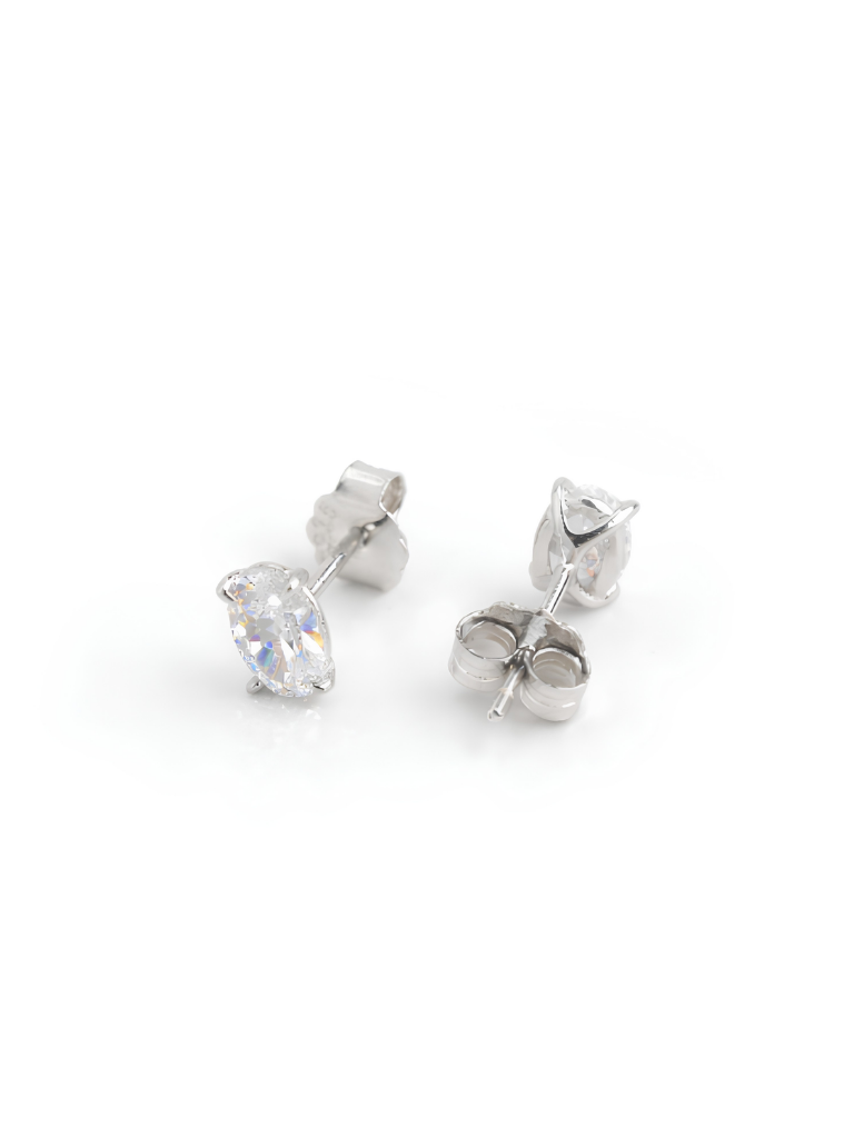 MNML Élora Eternal Brilliance Stud Earrings Oval Cut pair flat lay — 8A CZ oval solitaire 925 silver