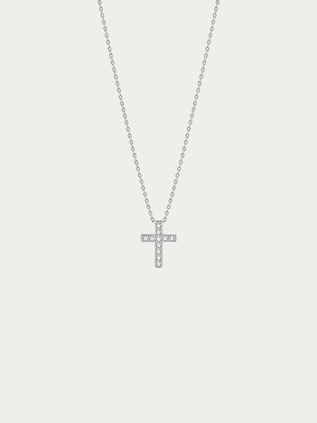 Elowen Pavé Cross Necklace with a small cross fully set with CZ in rhodium-plated 925 sterling silver, front view
