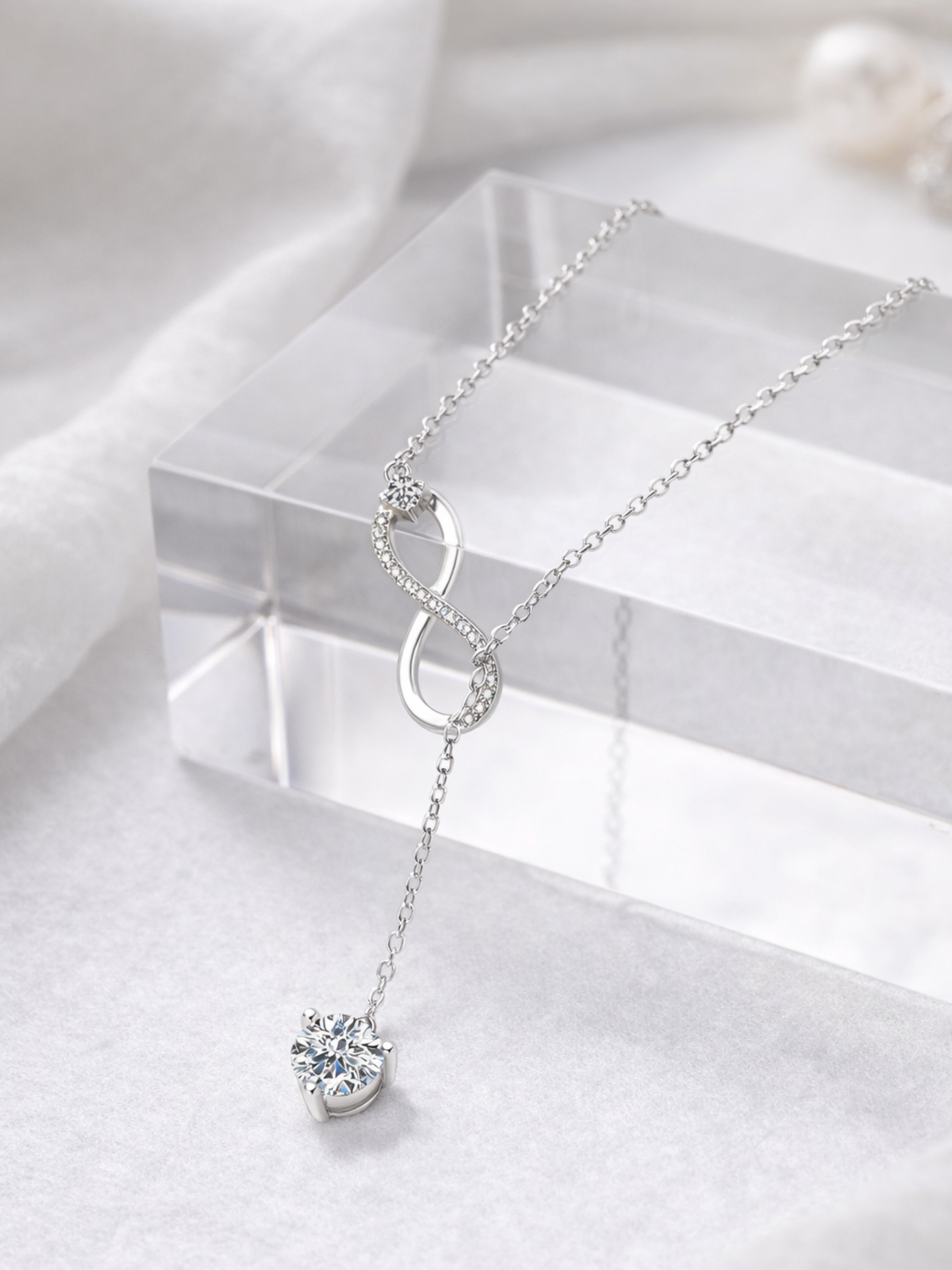 Elyra Infinity Drop Moissanite Necklace laid flat