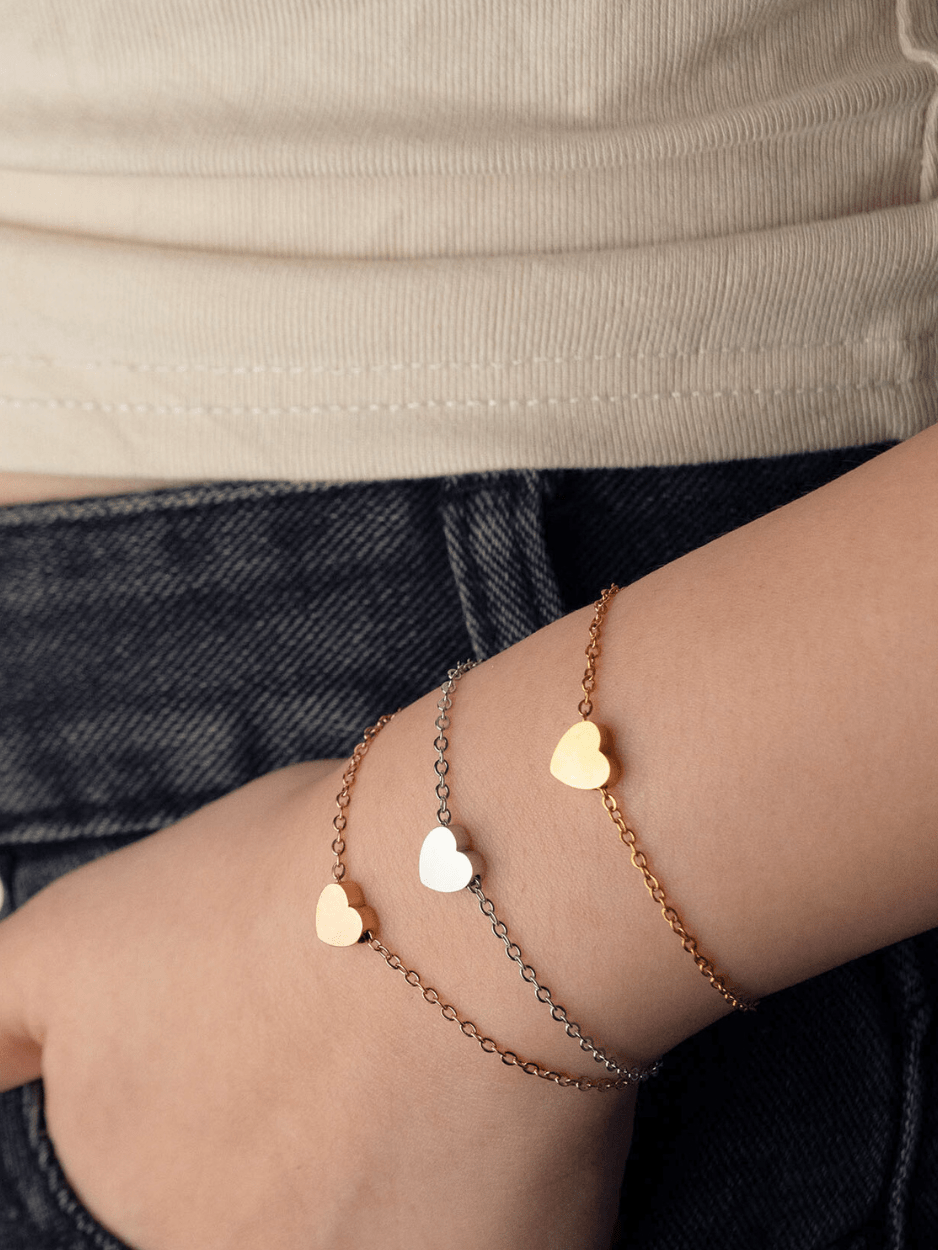 Model wearing MNML Erina Mini Heart Engravable Bracelet on wrist — personalised bracelet Malaysia