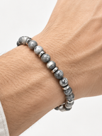 Ezra map stone bracelet worn on a man's wrist