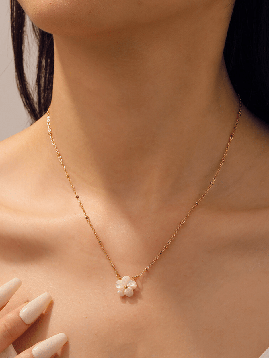 Model wearing MNML Fleur Blanche Necklace at collarbone — feminine flower necklace everyday Malaysia