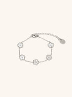 Model wearing MNML Floral Clovers Bracelet in silver on wrist — delicate clover bracelet everyday Malaysia