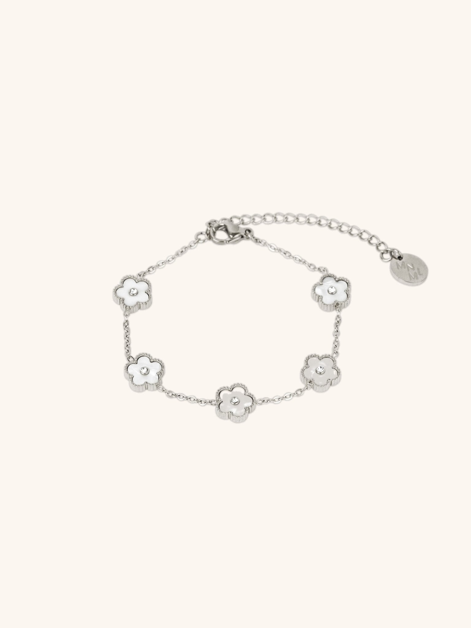 Model wearing MNML Floral Clovers Bracelet in silver on wrist — delicate clover bracelet everyday Malaysia